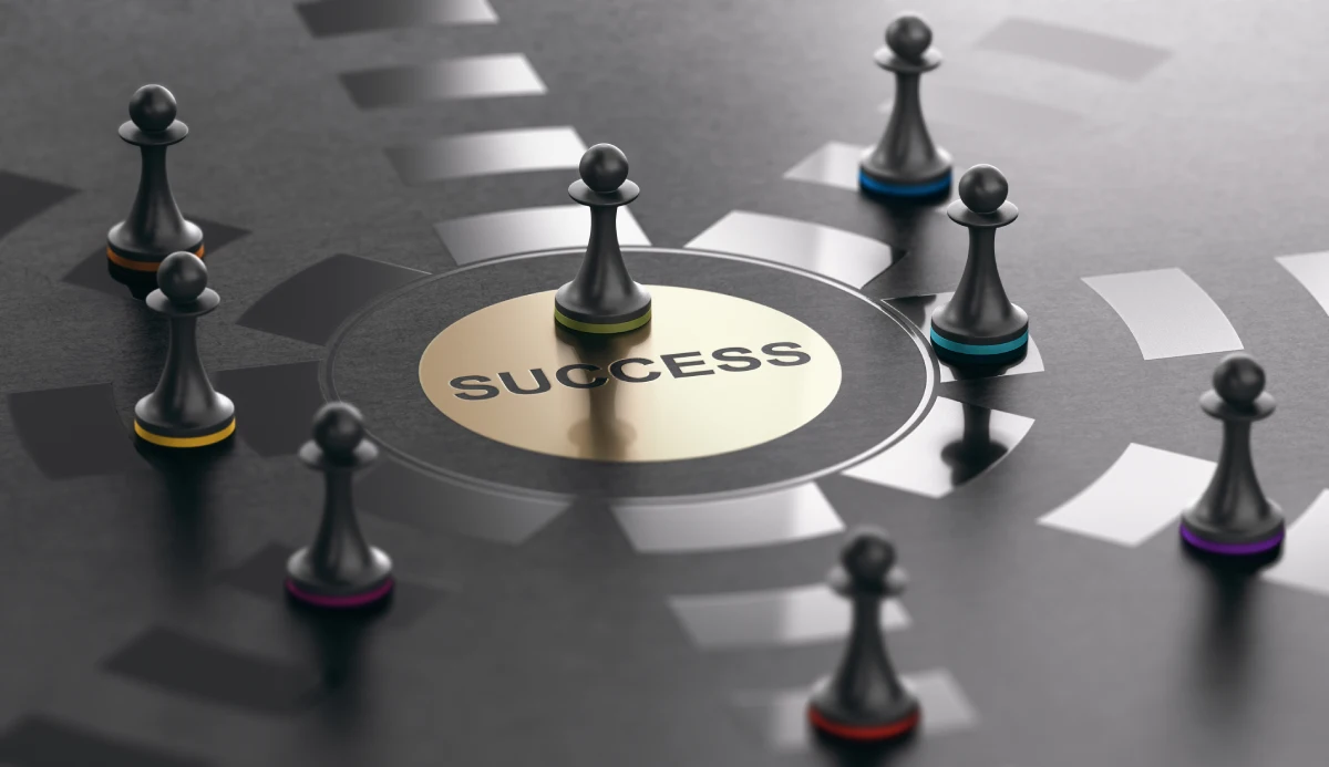 3d illustration of pawns over black background with the green one achieving success. Why your website is so important concept